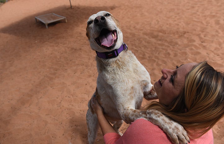 Kayla Sedbrook with a smiling Arroyo, the heeler mix 