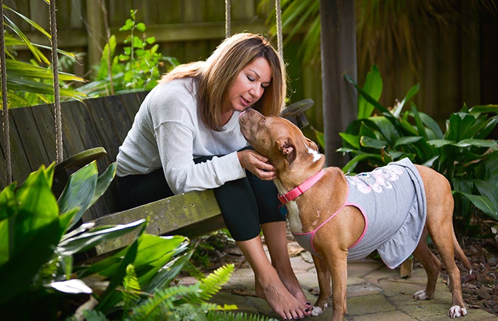 Vicki Kilmer, director of business intelligence and strategy, with Mia the dog