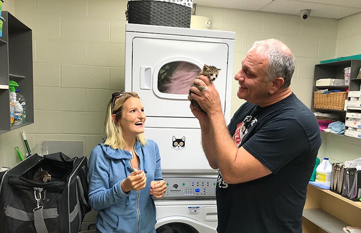 Tom Hubric holding a foster kitten