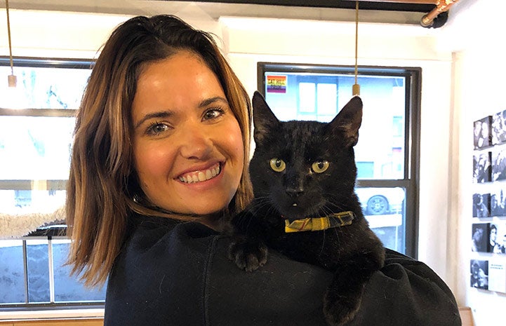 Caitlin holding Quigley the cat