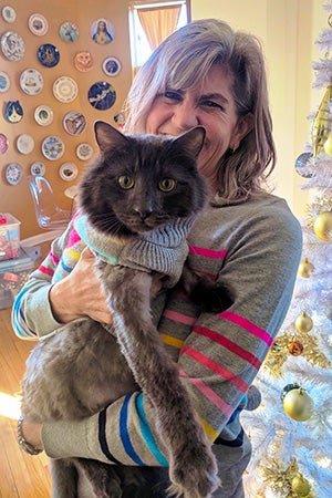 Woman holding Elroy the cat