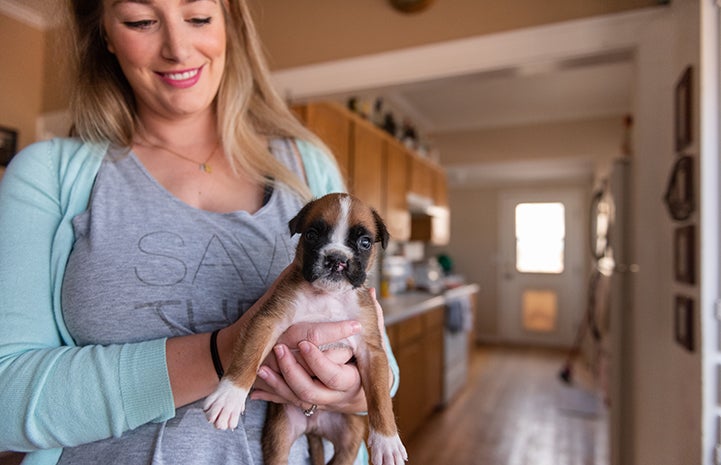 Erin holding Taco, the puppy with a cleft palate