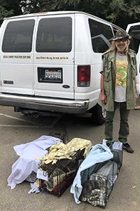 Michael with some of his feline friends, ready to head home after spay/neuter surgeries.