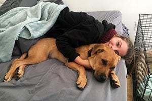 Danielle snuggling with Melo the puppy