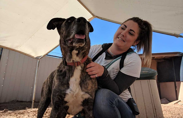 Tierney with Lana the dog in Dogtown under a sun shade