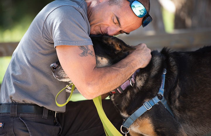 Man hugging Corban the dog