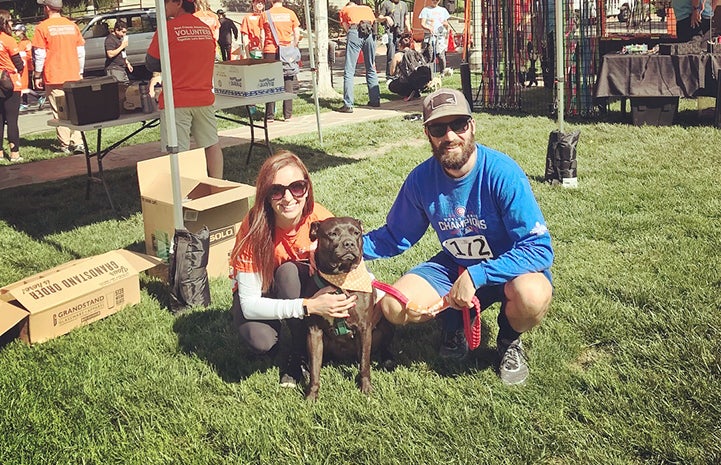 Ashley and Travis Tzioumis with Holly Dolores the dog at an event