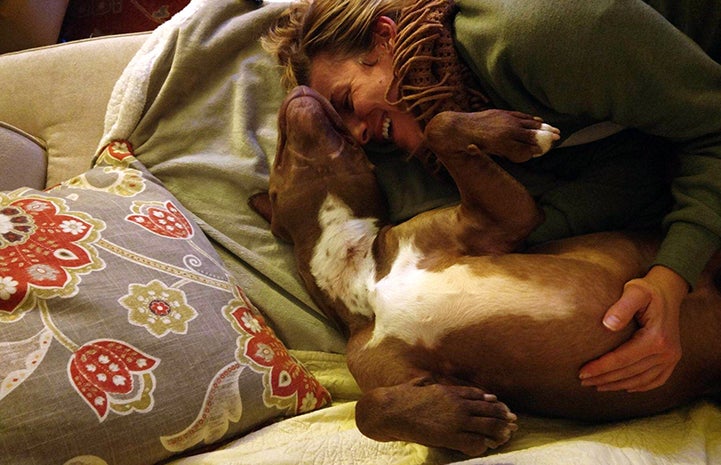 Amber Krzys snuggling with Parker the dog