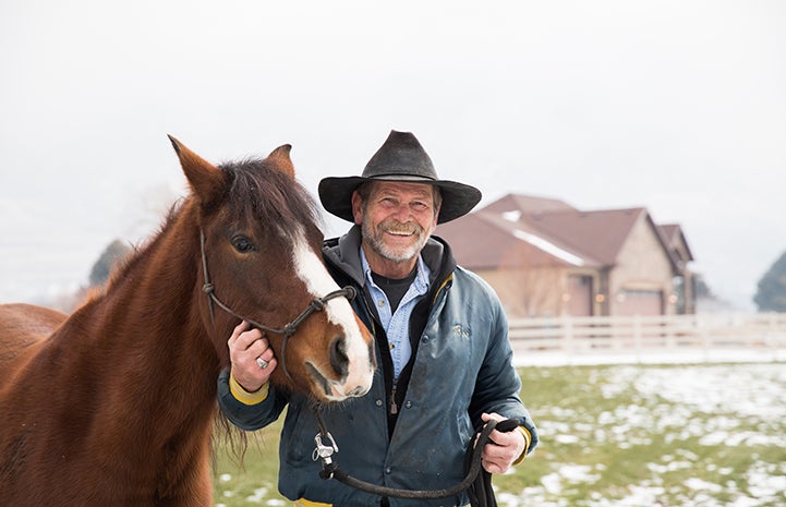 Daisy the horse with her adopter Bob