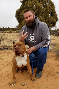 Ludo the brown and white dog with Ryan 