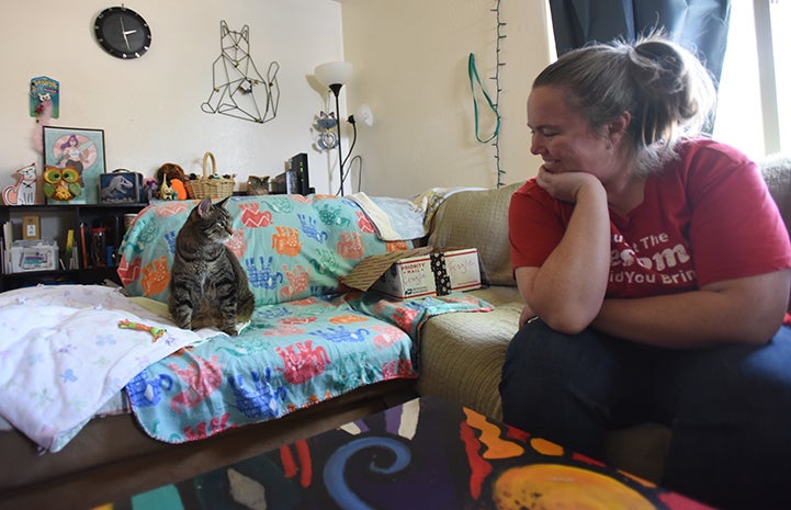 RJ, the incontinent brown tabby cat, with his person Heather