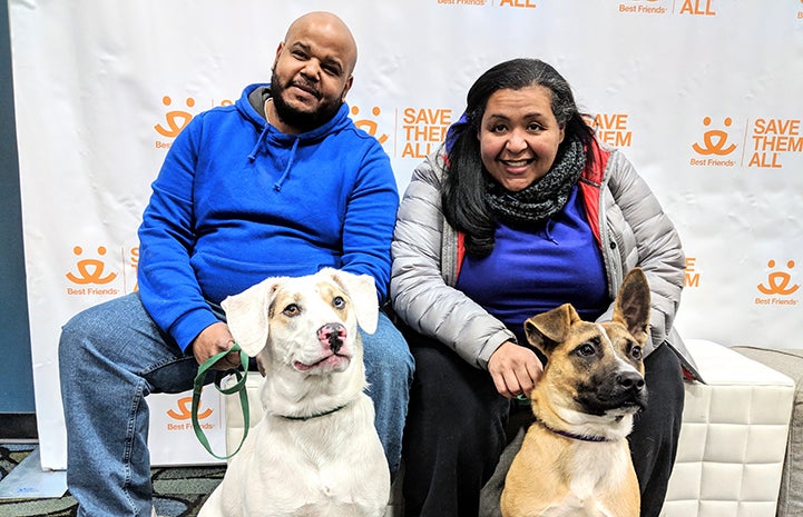 Two dog friends, Ozzy and Cody, being adopted together by a couple