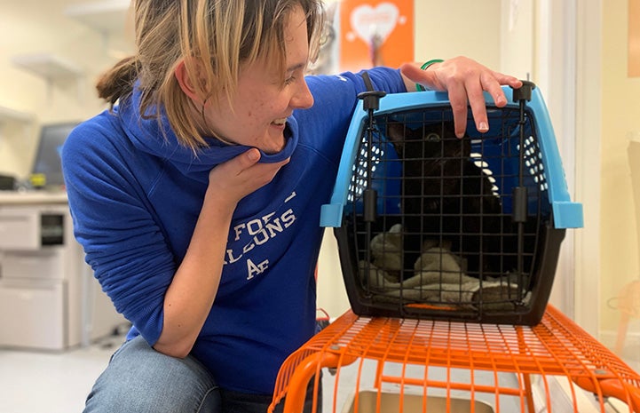 Woman holding Steward the kitten, who she just adopted