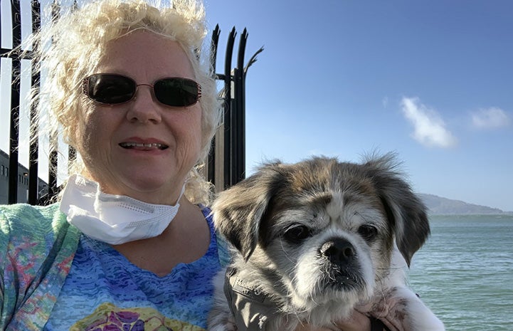 Cherie Thomas holding Andy the dog