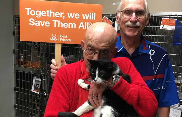 Robb and Jerry adopting Simon the black and white cat