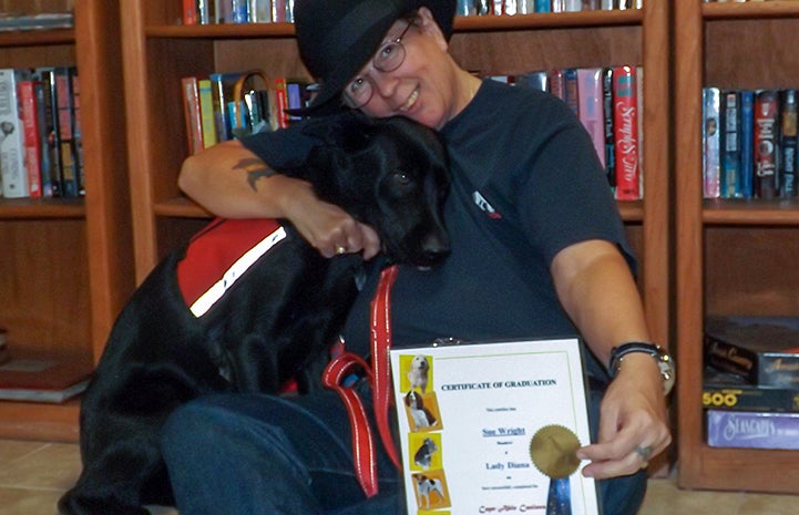 Lady Diana the dog at her graduation with veteran Sue Wright