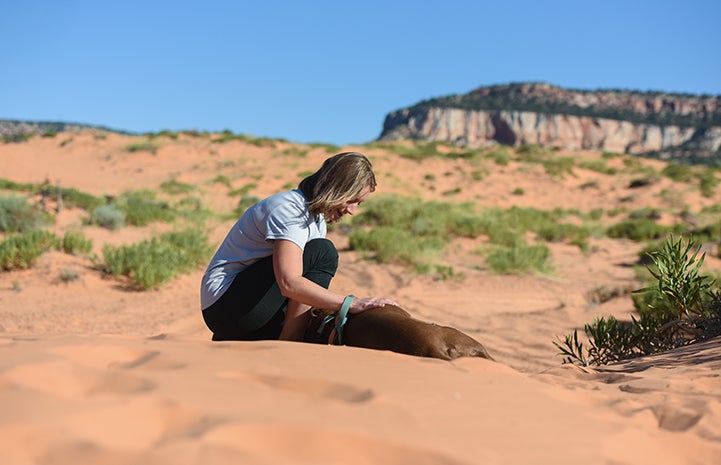 Amber Kohnhorst with YoYo the dog at the Sanctuary