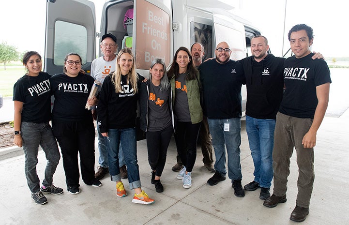 Group of people in Edinburg posting in front of a transport van