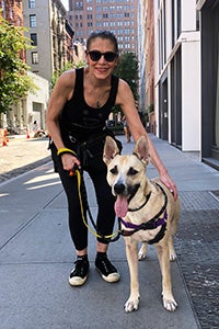 Volunteer Lauren Fishman walking a shepherd in New York