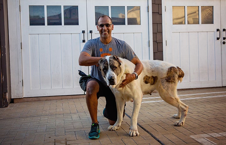 Volunteer Robert Lobo with Nancy Drew the dog