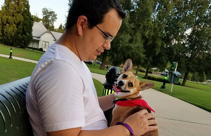 Volunteer Eric Granados walking Dolly the dog