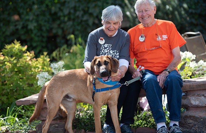 Volunteers Mary Rose and Vann Hollie with Uno the dog