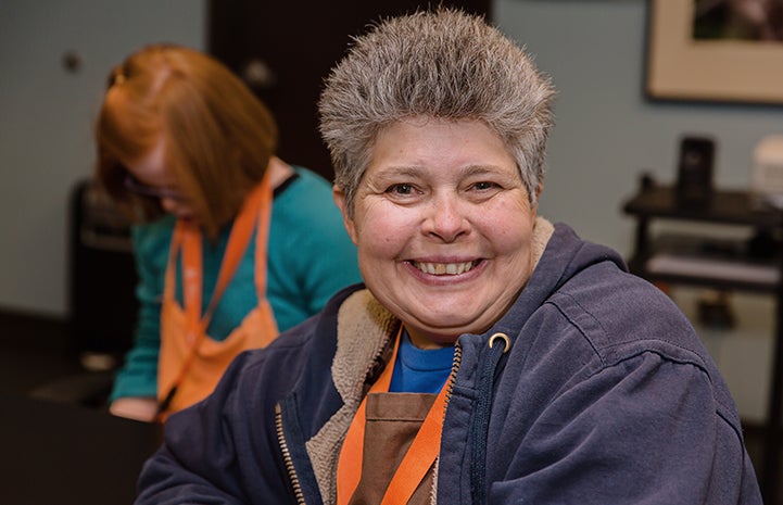 Smiling woman from Tierra Del Sol volunteering at the Best Friends Pet Adoption and Spay/Neuter Center in Los Angeles