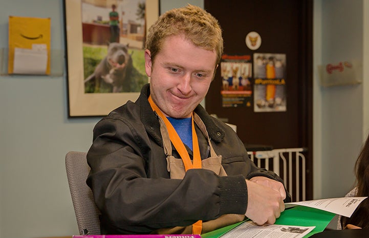 Man from Tierra Del Sol volunteering with paperwork at the Best Friends Pet Adoption and Spay/Neuter Center in Los Angeles