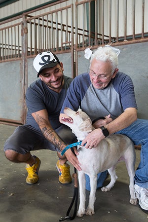 Winston the dog with Tony and Best Friends' Marc Peralta