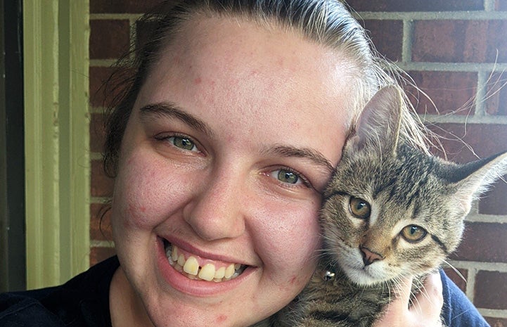 World Market employee and the kitten she adopted