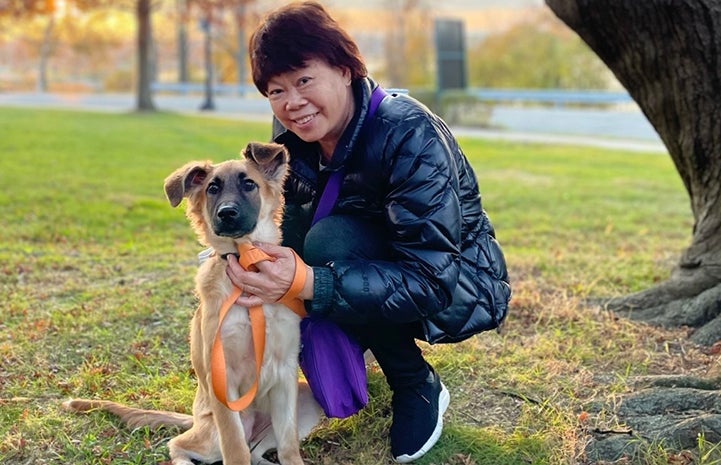 Woman with Pickle the puppy