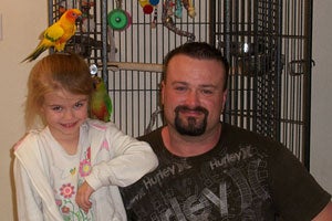 Pair of conures with their new family