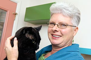 Leslie Cobb holding a black cat