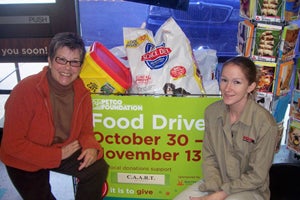 Volunteers collecting donations for pets during the National Pet Food Drive