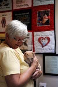 Peggy holding her adopted cat Juniper