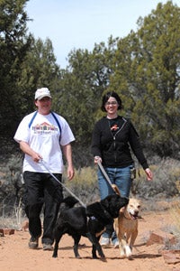 Dailey and Buddha out for a walk with volunteers