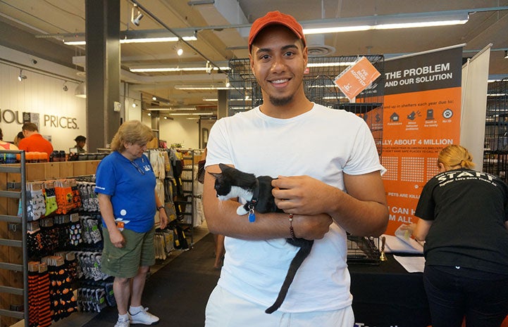 Making a new friend at the DSW Designer Shoe Warehouse BOBS from Skechers Cats and Kicks cat adoption event