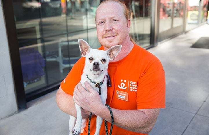 Trevor Potter and Oscar the Chihuahua mix at the Best Friends Pet Adoption Center in Salt Lake City