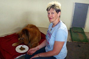 Brenda with her tattoo and the dog named Orlando