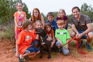 Geneva the dog loves to be at the center of the crowd of kids