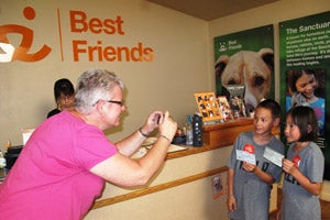 Brianna and Matthew present their checks to Best Friends