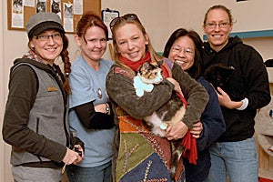 Dianne, staff and friends all saying good-bye to Athena the cat who was adopted