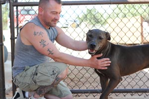 Shawn, an animal Reiki practitioner, with Gallup the dog