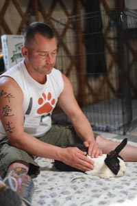 Shawn performing Reiki on Sadie the rabbit