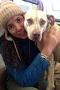 Lindsey Fontana hugging a pit bull dog