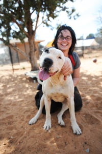 Haylee and Yuma the once-anxious dog share a snuggle