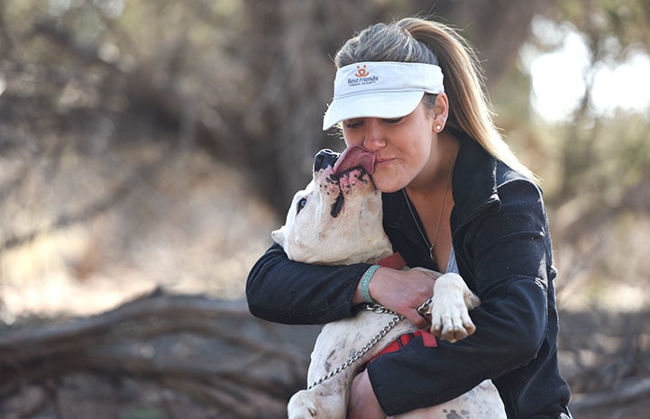 A hug and kiss between Ralph the dog and Tierney