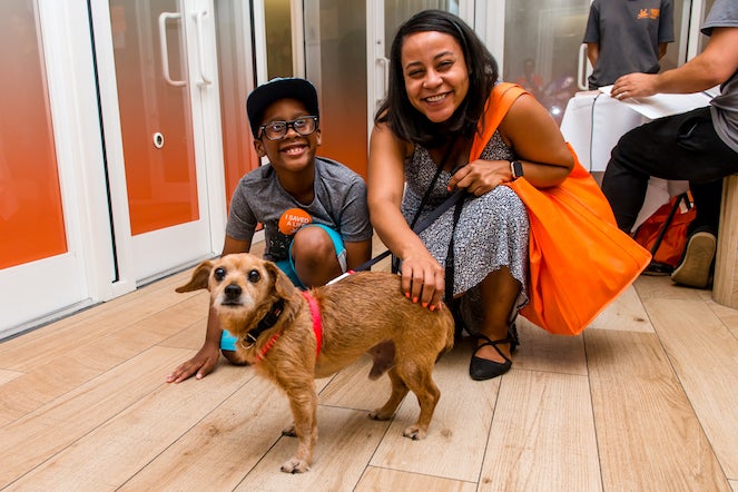 Family with their adopted small dog