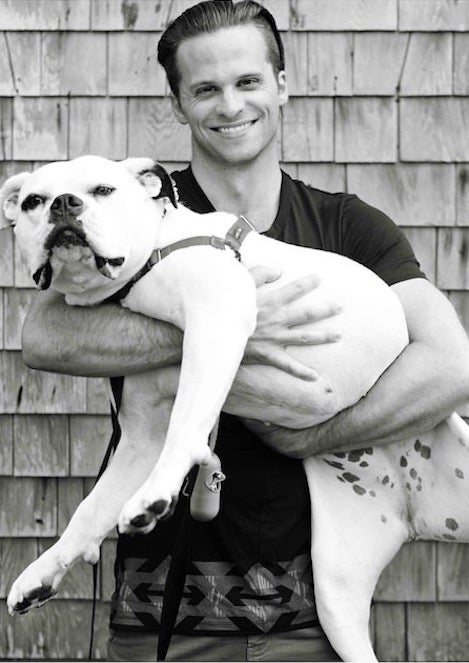 Man holding a big dog