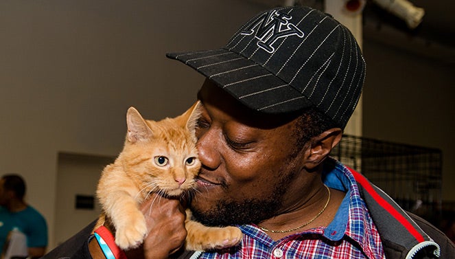 Man with his adopted cat